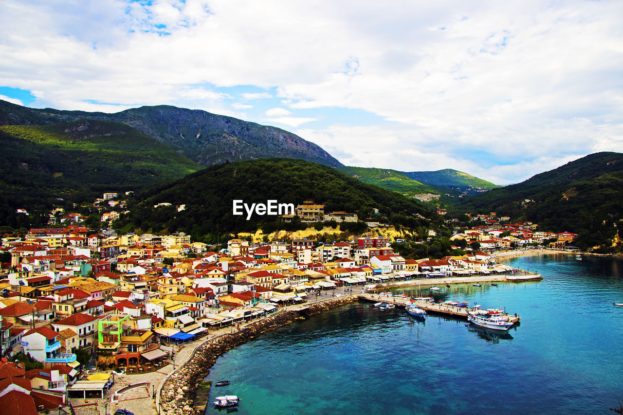 SCENIC VIEW OF RIVER WITH MOUNTAINS IN BACKGROUND