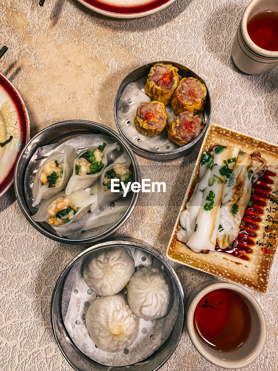 High angle view of dim sum food served on table