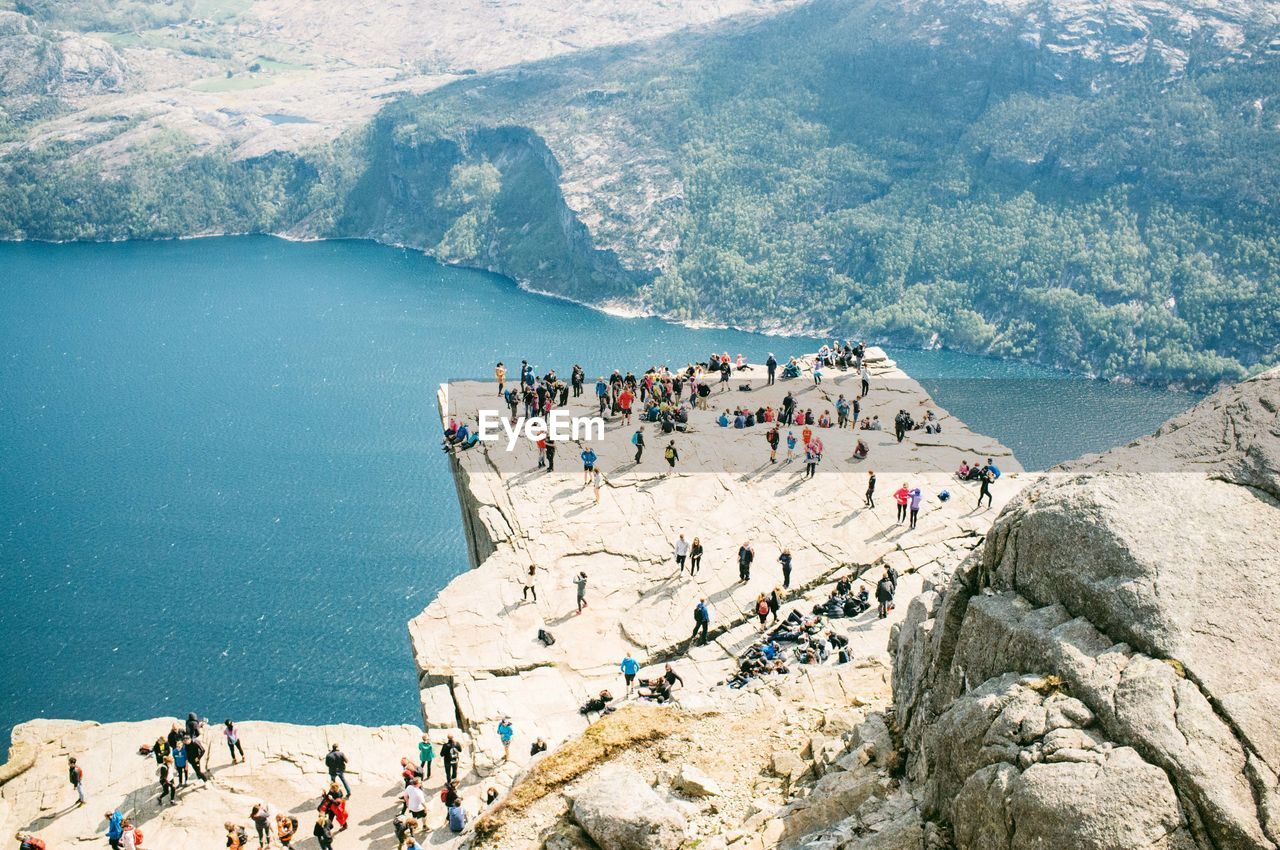 High angle view of people overlooking calm lake