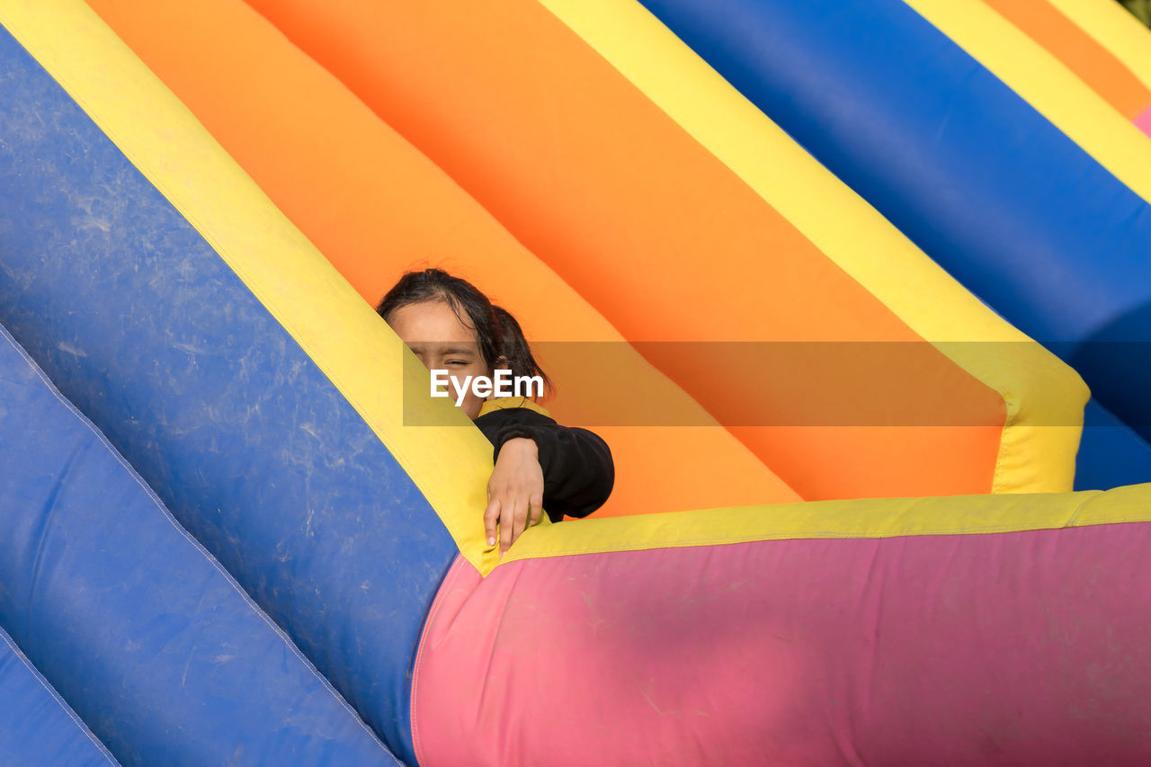 Portrait of a little girl sitting on inflatable ring