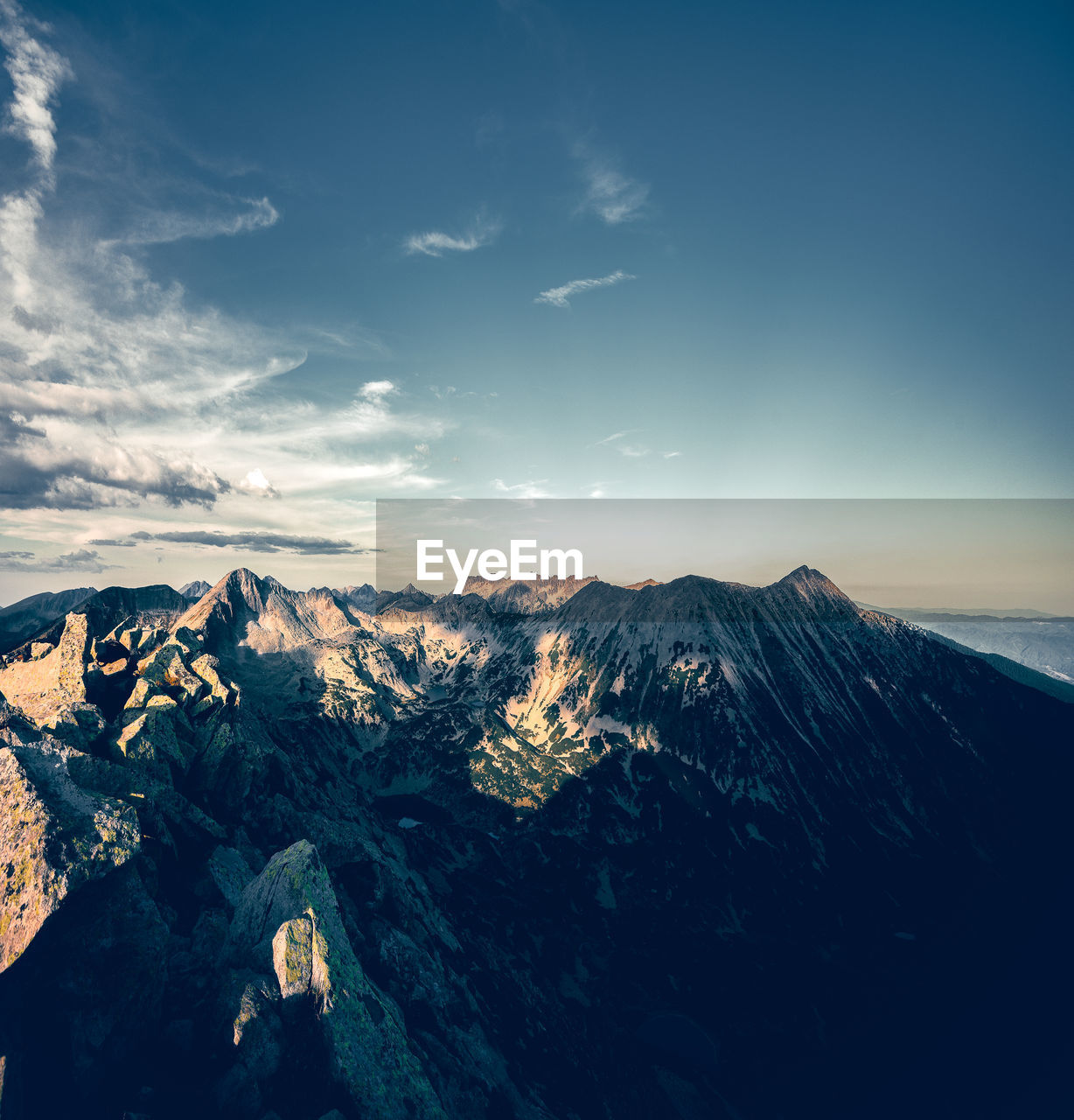 Scenic view of mountain range against sky