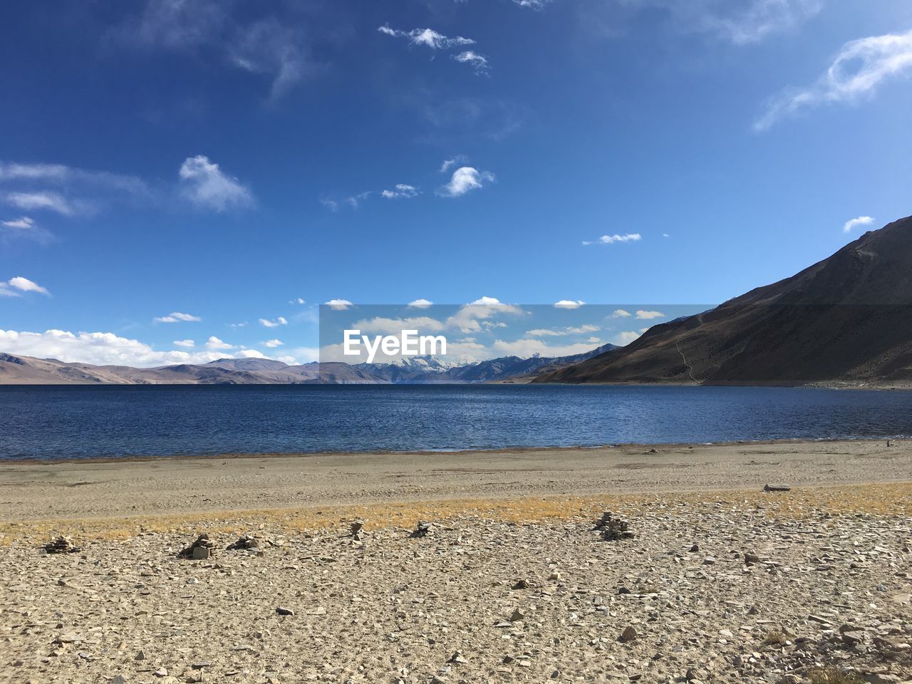 Scenic view of sea against blue sky