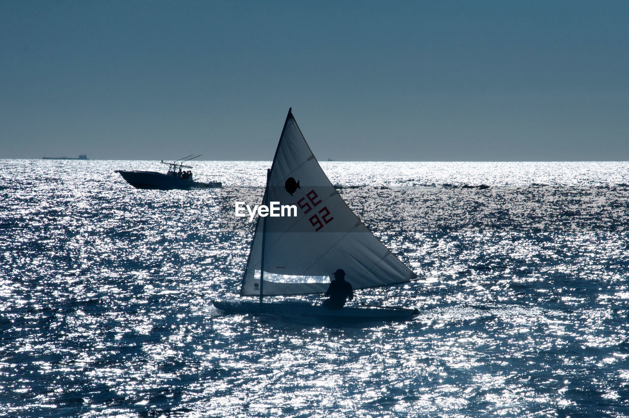 sea, sailing, water, vehicle, boat, sailboat, ship, nautical vessel, nature, transportation, sky, ocean, sports, horizon over water, watercraft, copy space, horizon, clear sky, day, mode of transportation, sailing ship, travel, no people, outdoors, beauty in nature, scenics - nature, motion, wind, dinghy, sunlight, sunny