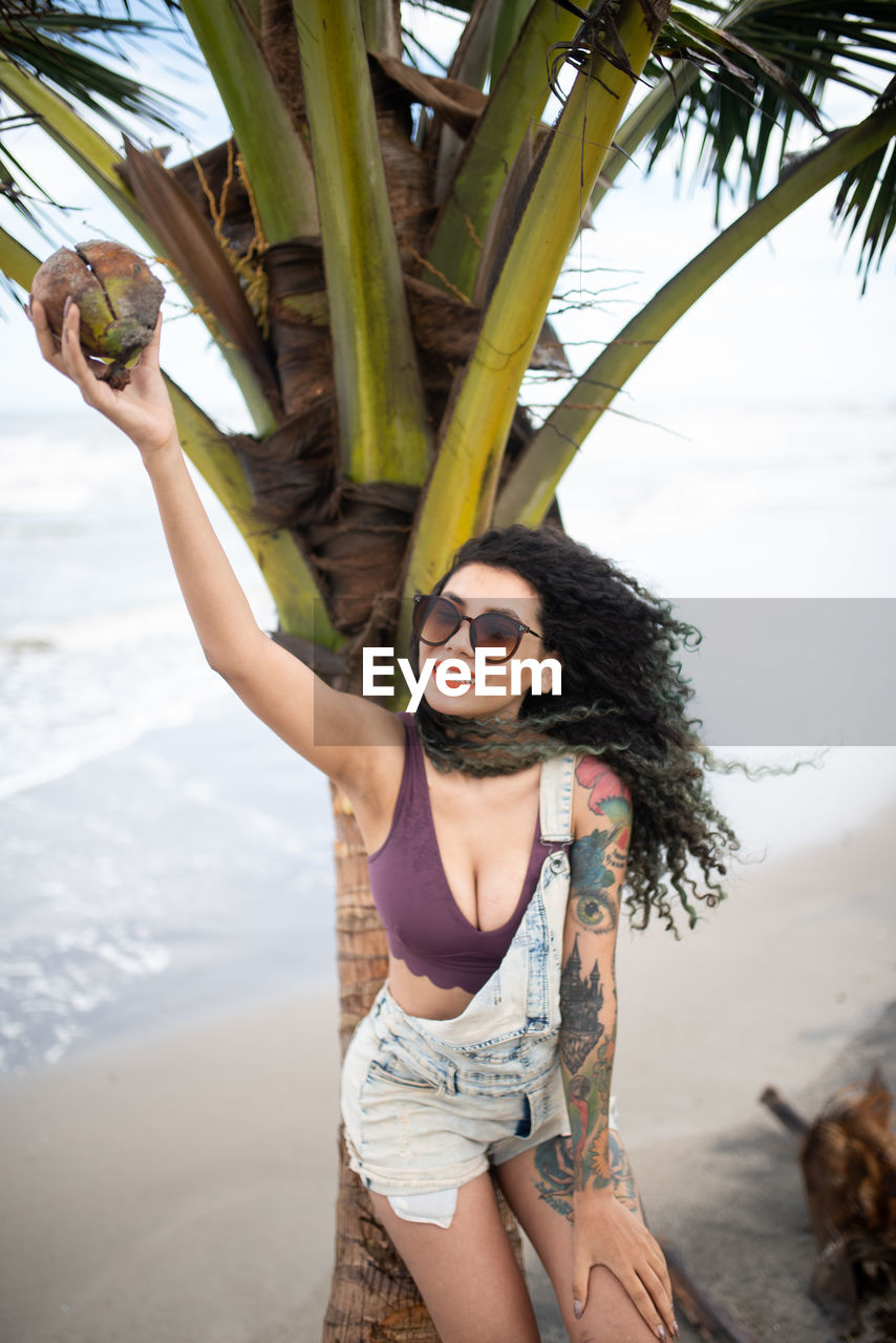 Woman wearing sunglasses at beach