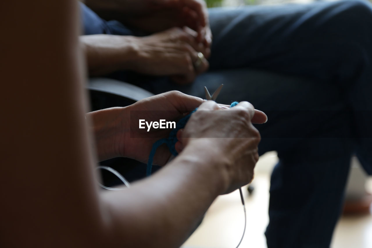 Close-up of hands knitting