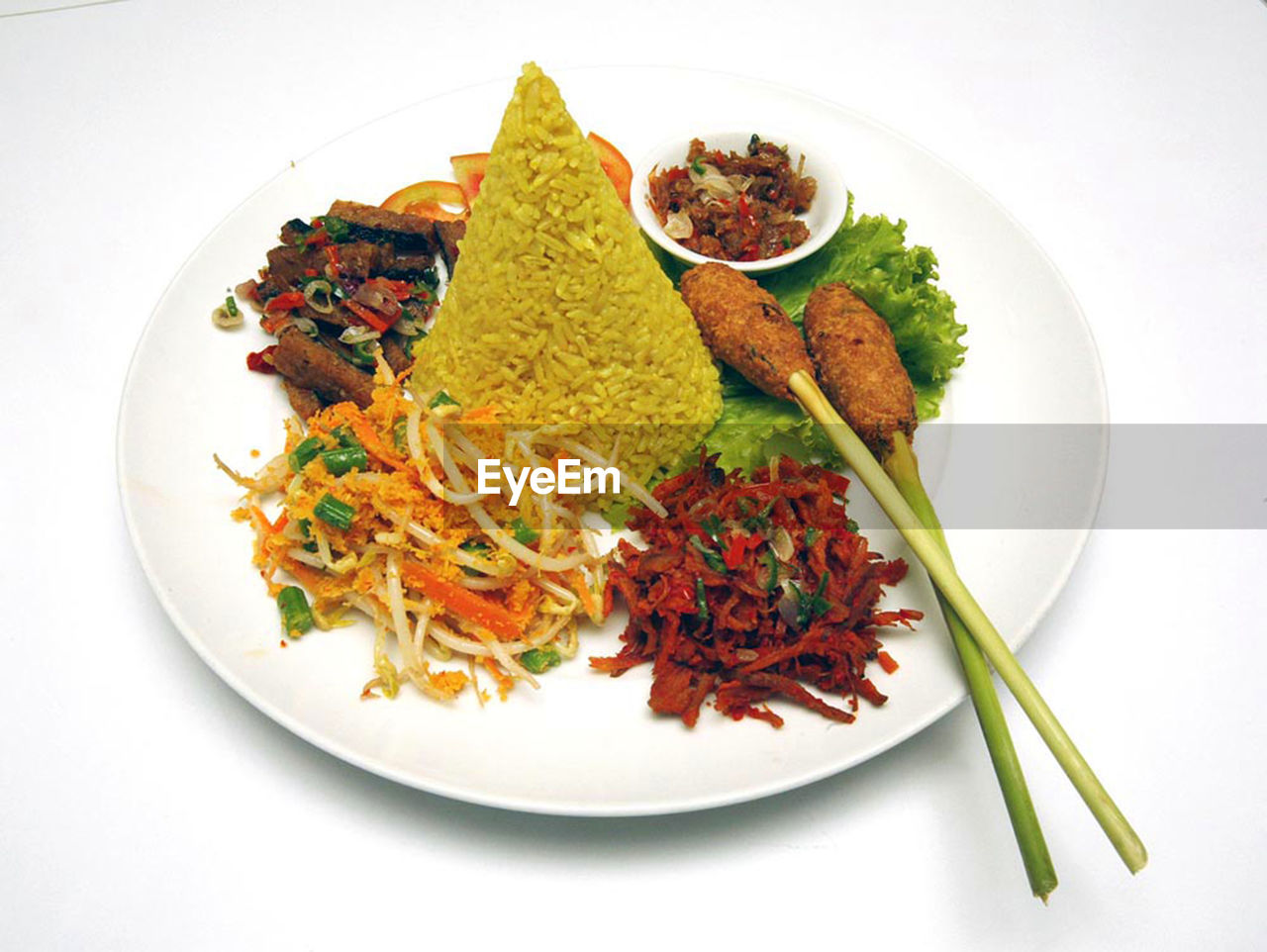 High angle view of nasi tumpeng served in plate on table