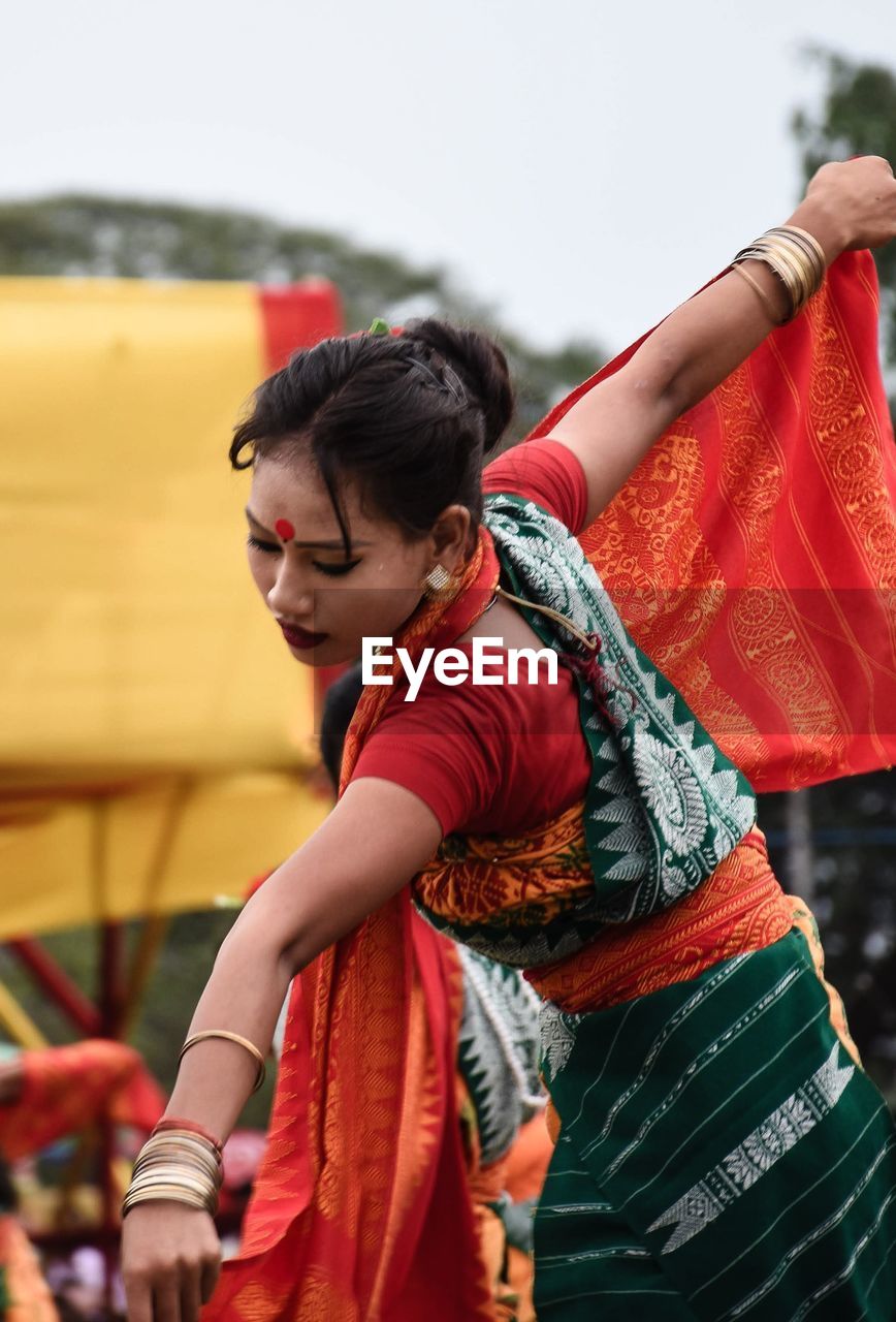 Young woman dancing outdoors