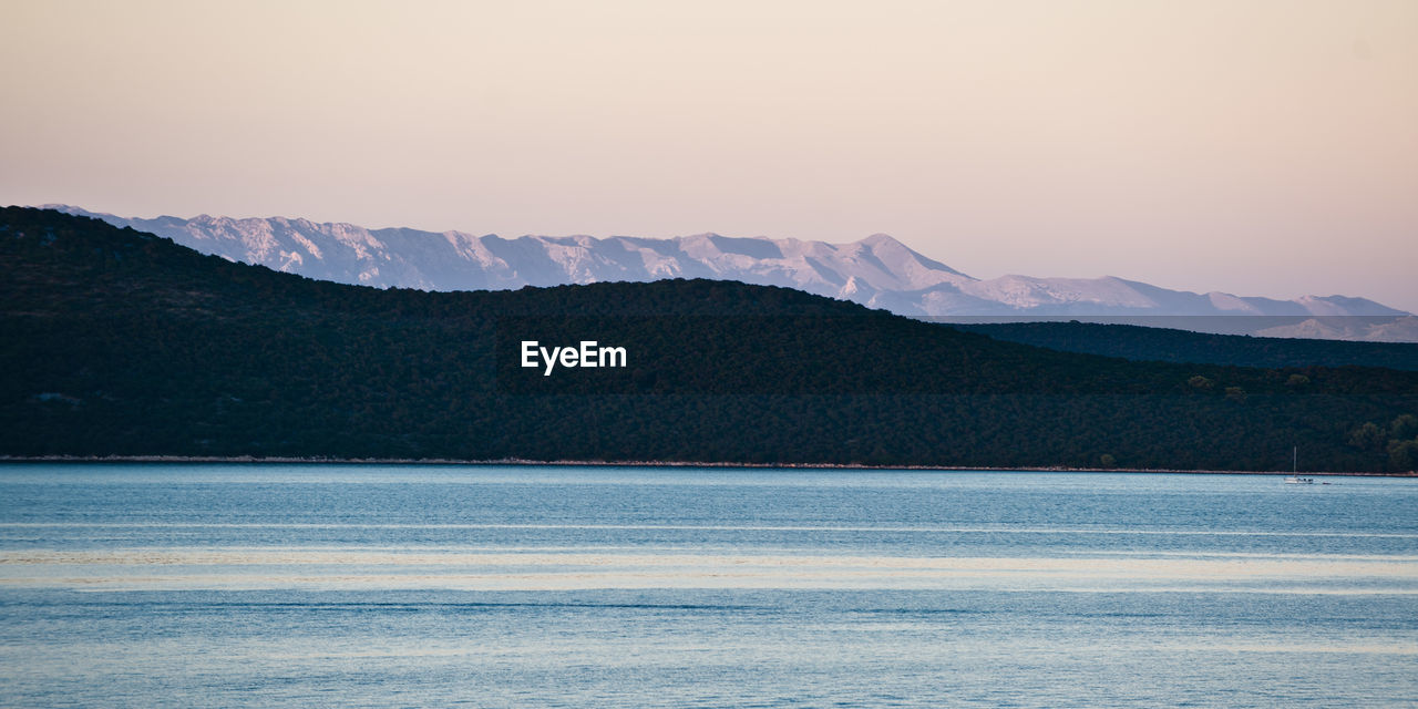 Scenic view of adriatic sea by mountains