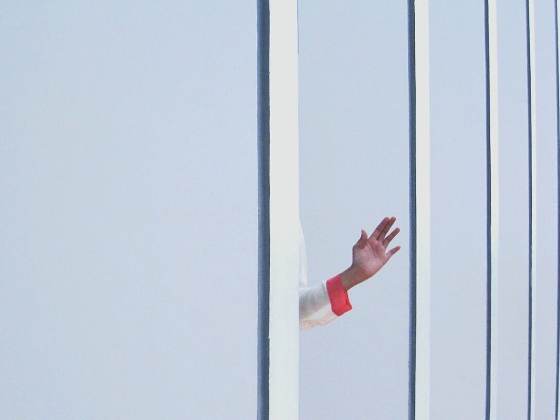 FULL LENGTH OF WOMAN STANDING ON WALL