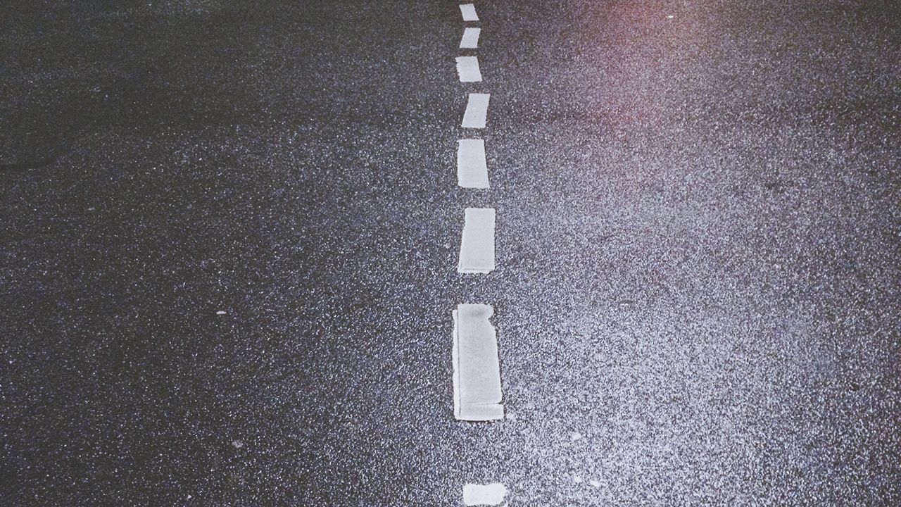 High angle view of empty road at night