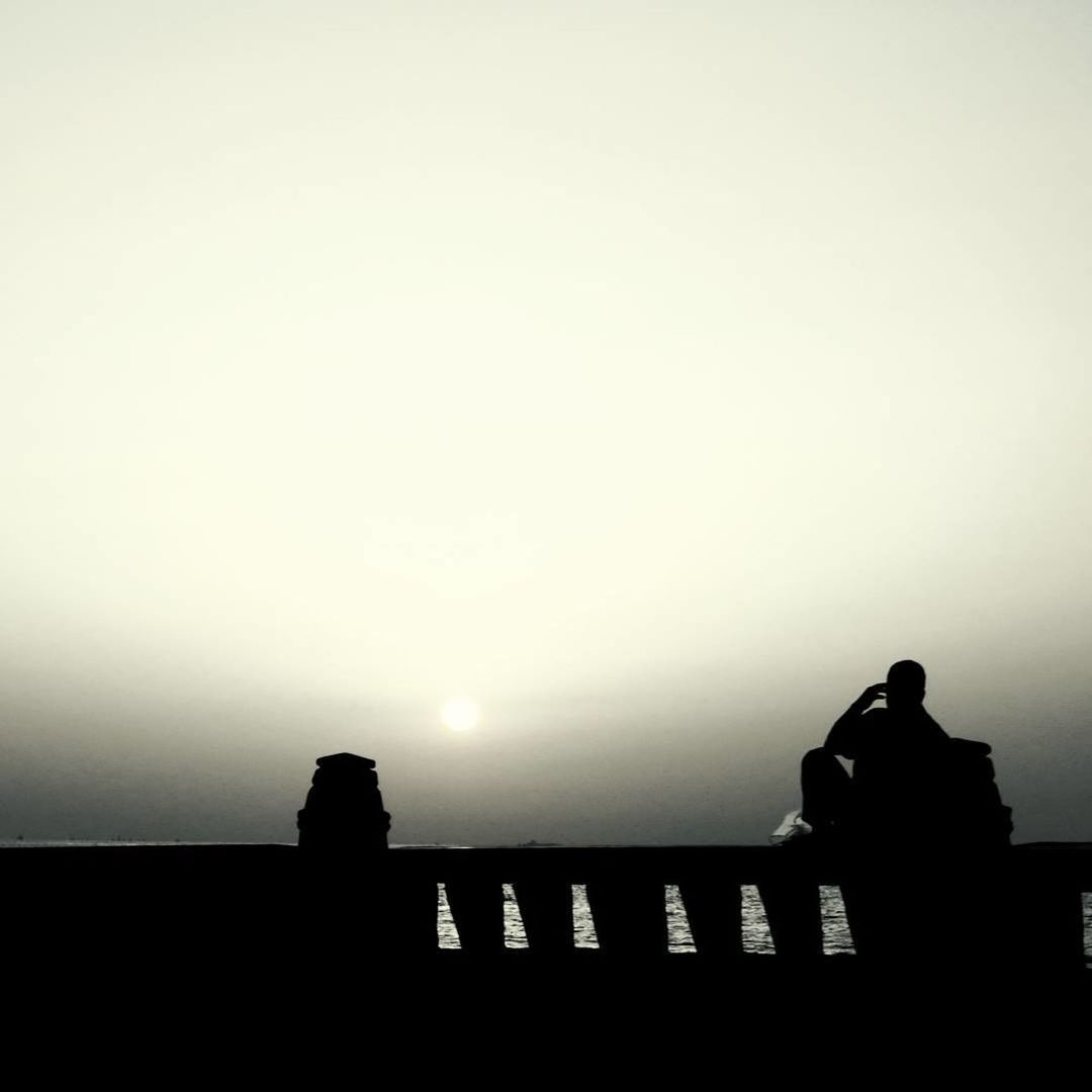 SILHOUETTE MEN AGAINST SKY AT SUNSET