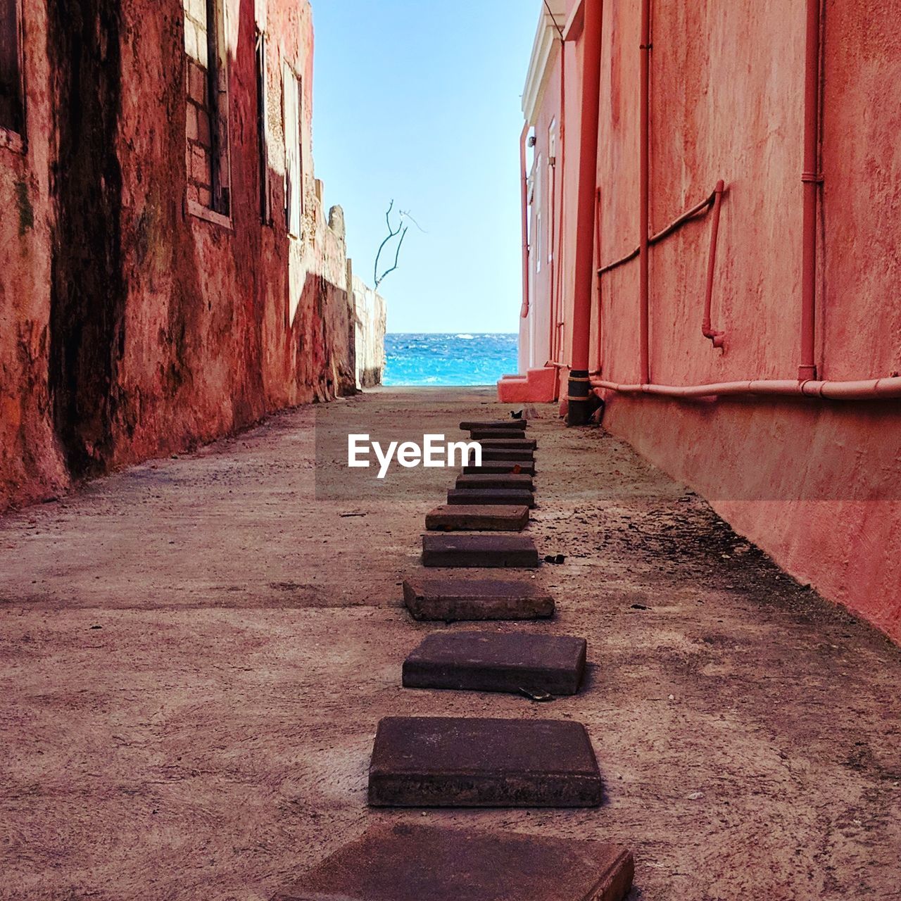 Steps on beach against sky