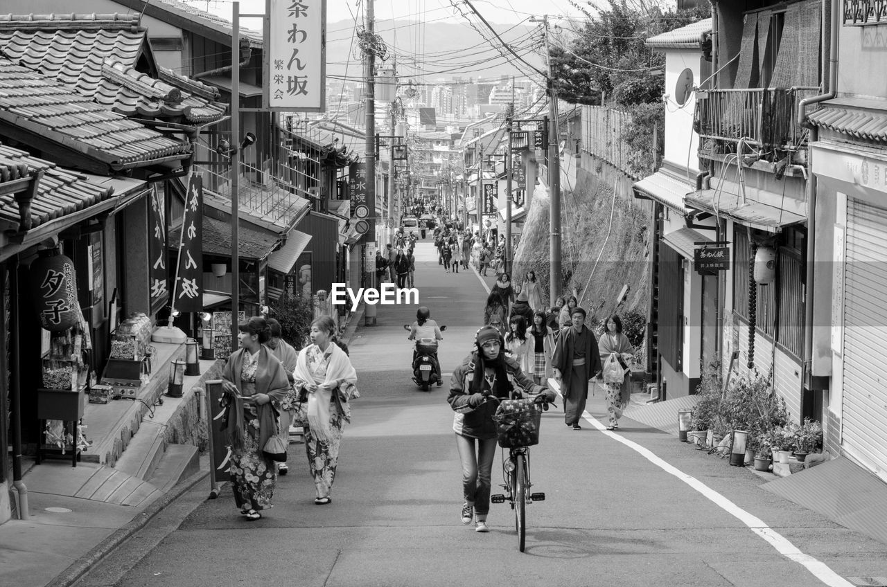 Group of people walking at market