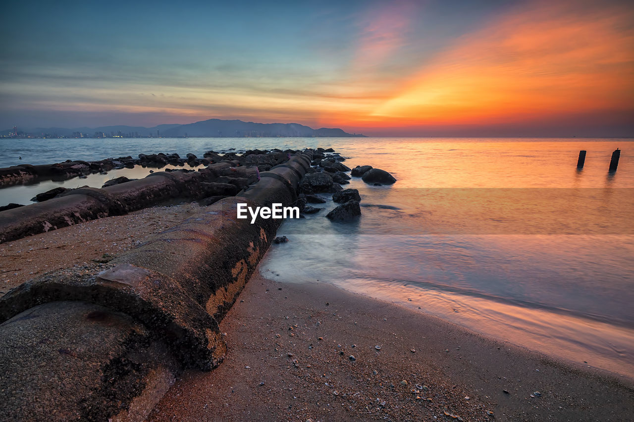 Scenic view of sea against sky during sunset