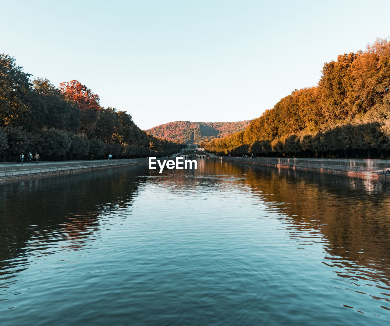 Scenic view of lake against clear sky during autumn