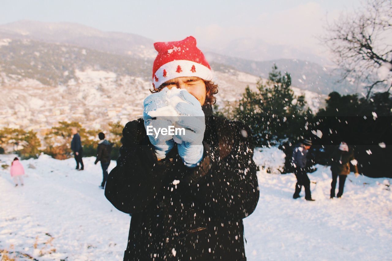 Full length of man on snow covered landscape