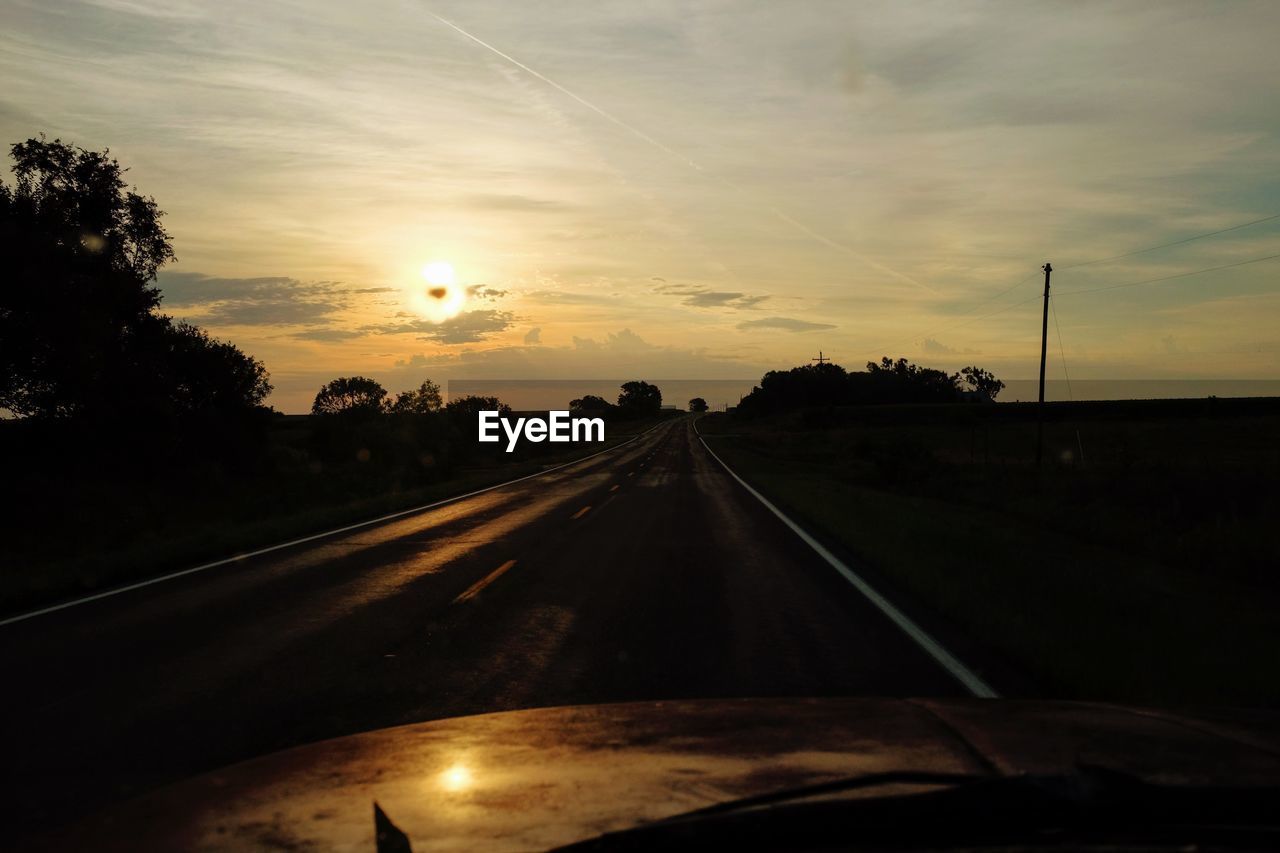 ROAD AGAINST SKY AT SUNSET