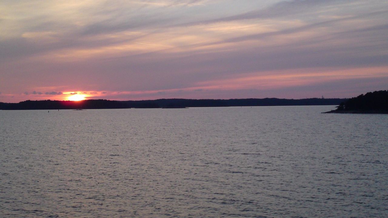 View of calm sea at sunset