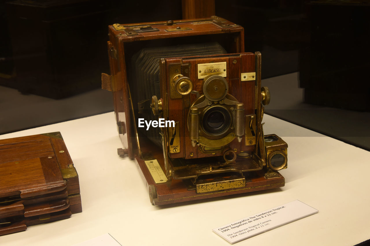 CLOSE-UP OF CAMERA AND TABLE