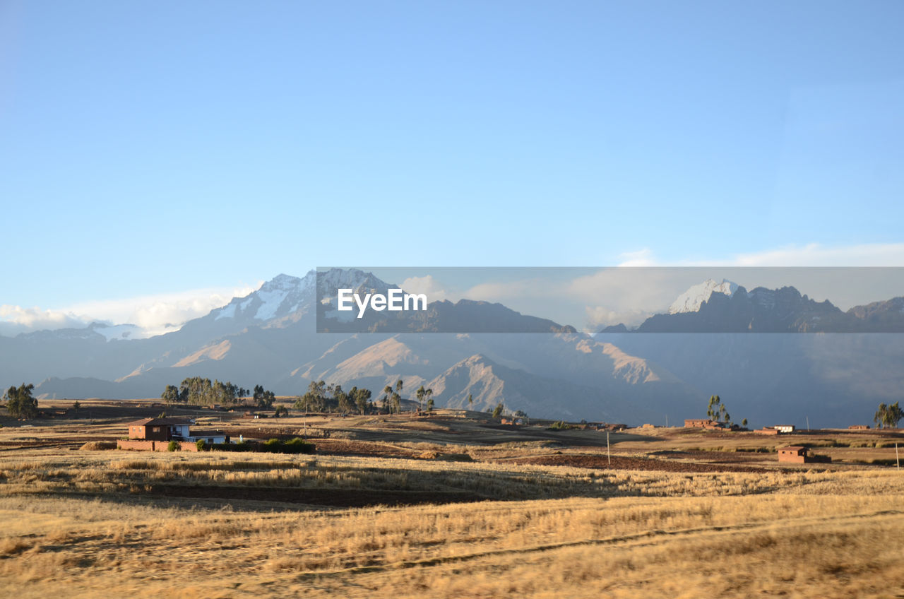 View of a village with mountains in the background