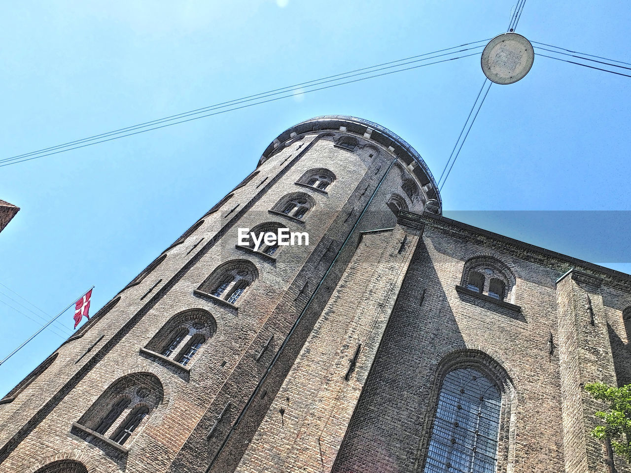 LOW ANGLE VIEW OF BUILDINGS AGAINST BLUE SKY