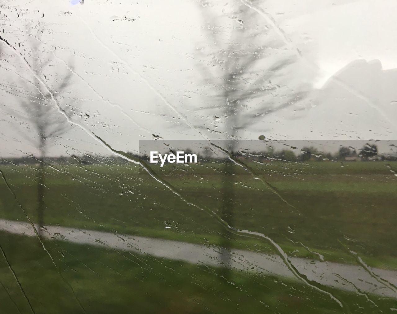 CLOSE-UP OF WET WINDOW DURING RAINY SEASON