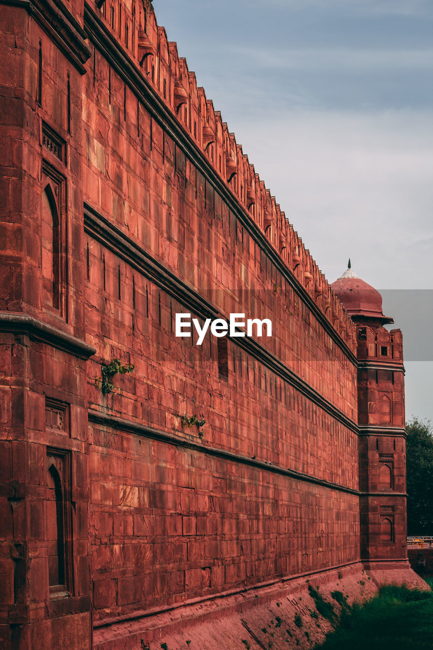 LOW ANGLE VIEW OF RED BRICK BUILDING