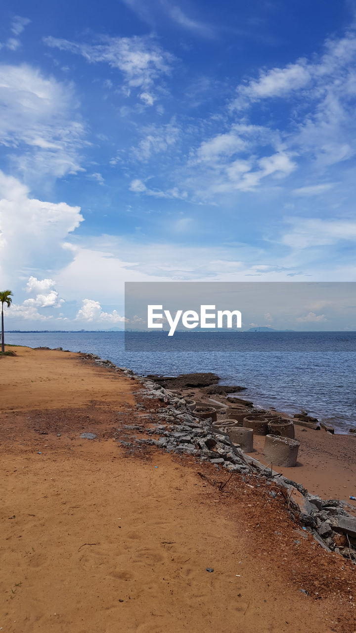 Scenic view of beach against sky