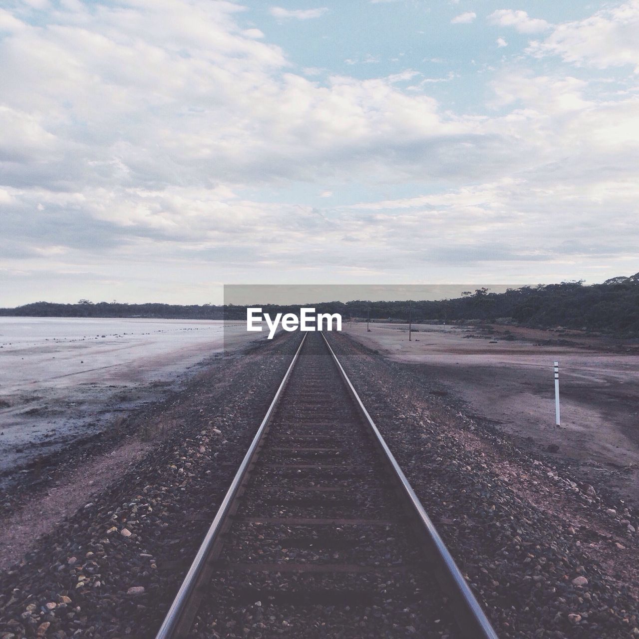 Railroad track passing through landscape