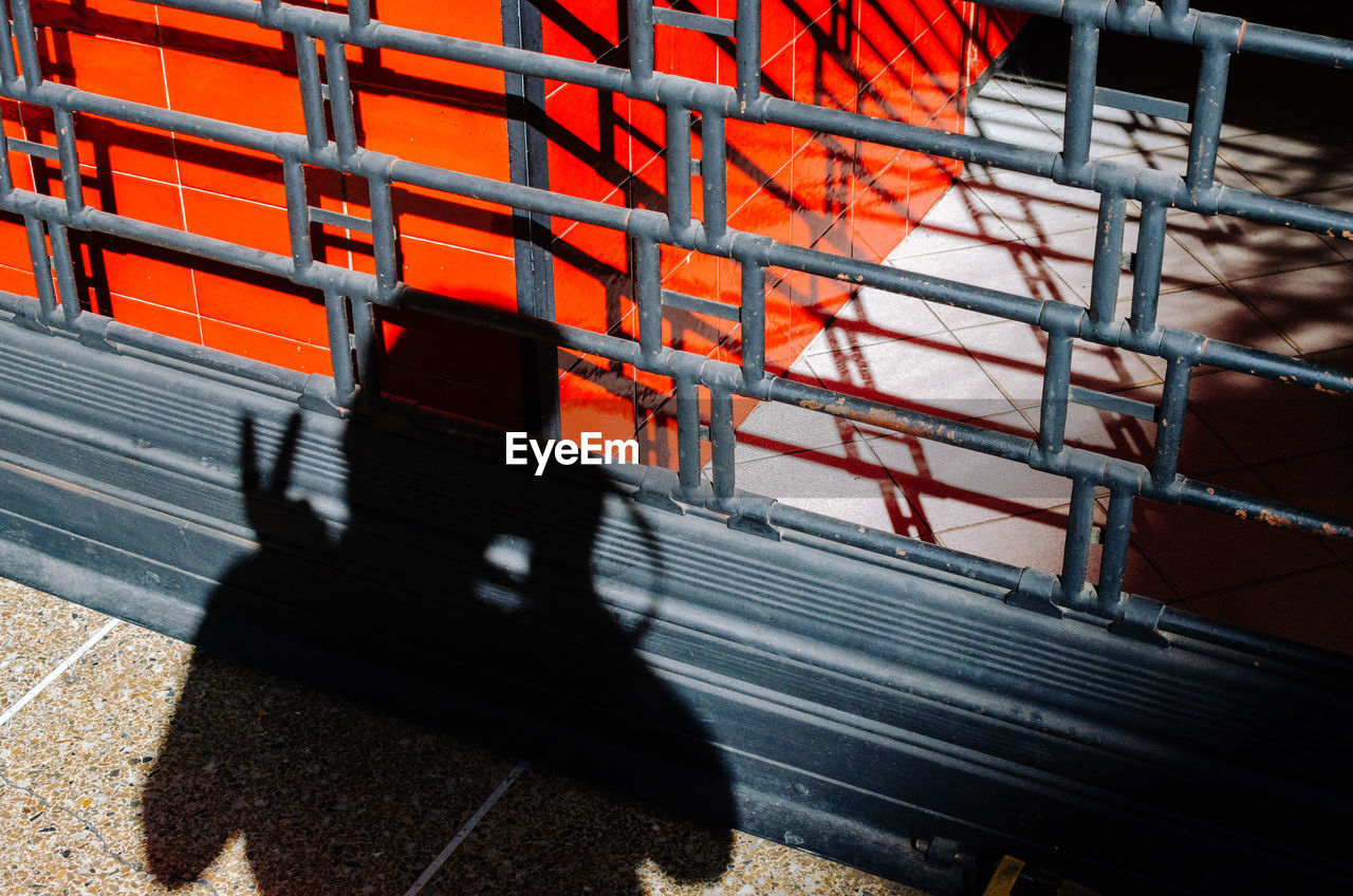 Shadow of man working at construction site