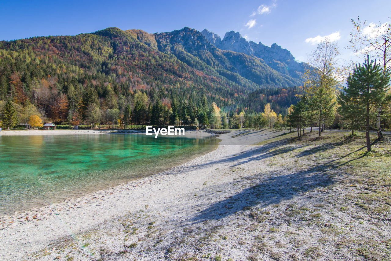 Scenic view of lake and mountains against sky