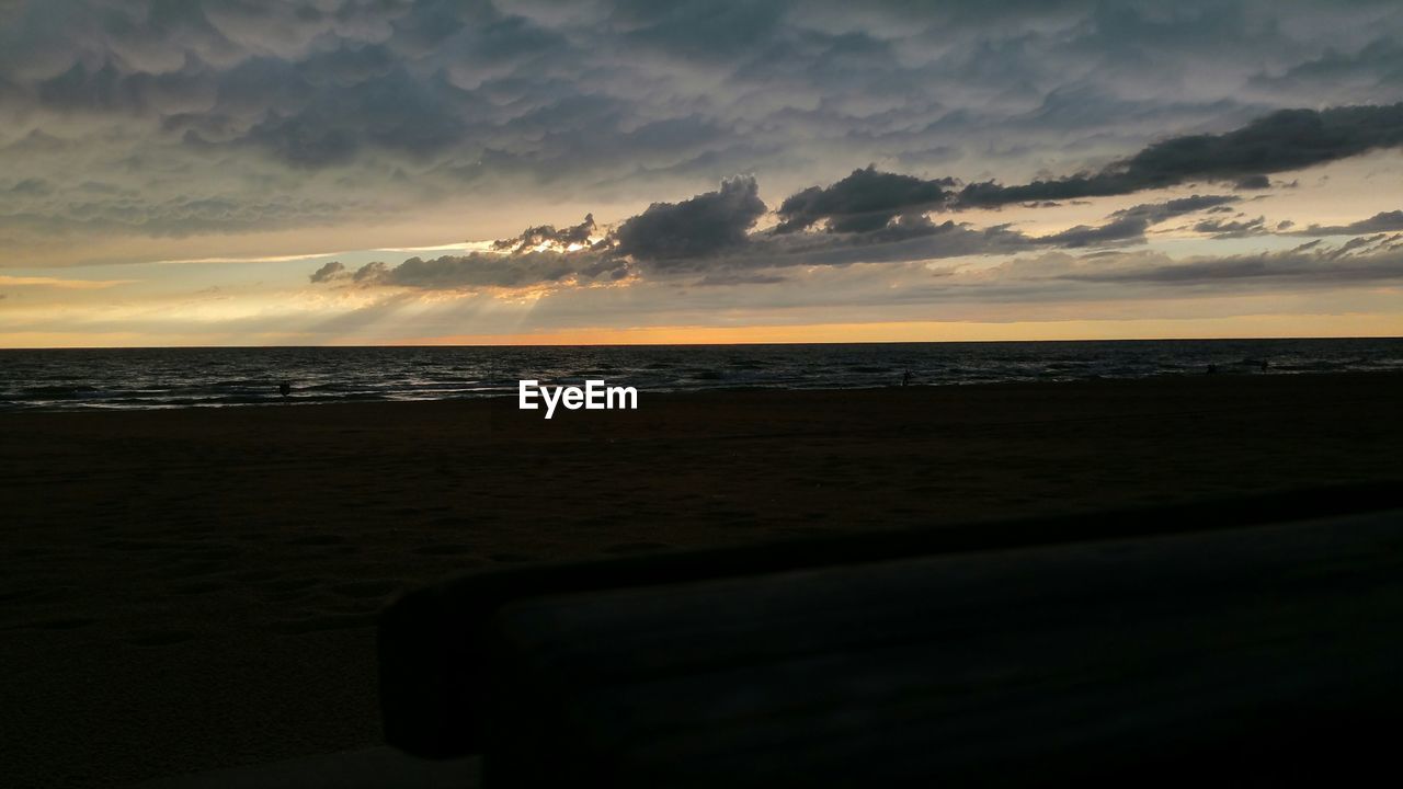 View of sea and beach at dusk