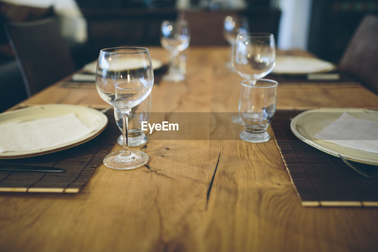 CLOSE-UP OF GLASSES ON TABLE