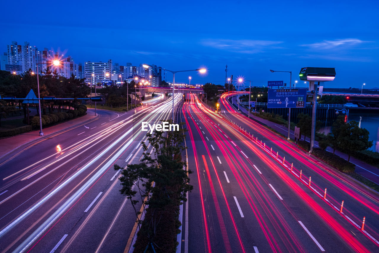 High angle view of light trails on road at night