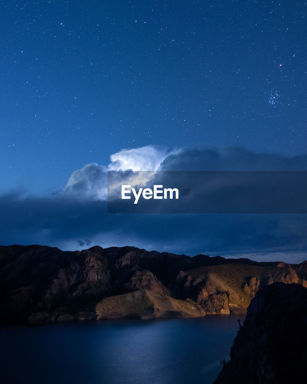 Scenic view of sea against sky at night