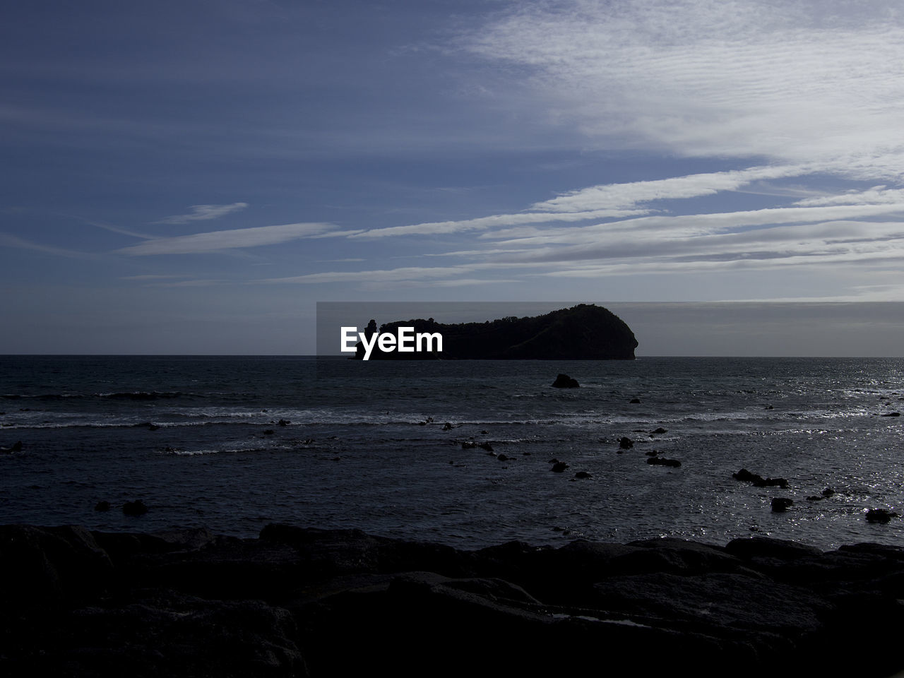 SCENIC VIEW OF ROCKS ON SEA AGAINST SKY
