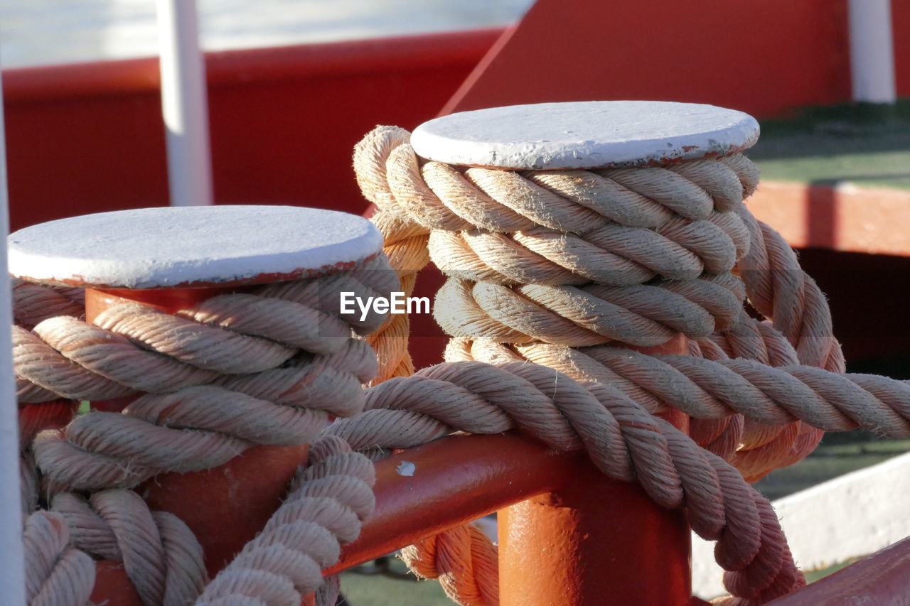 Close-up of rope tied to bollard