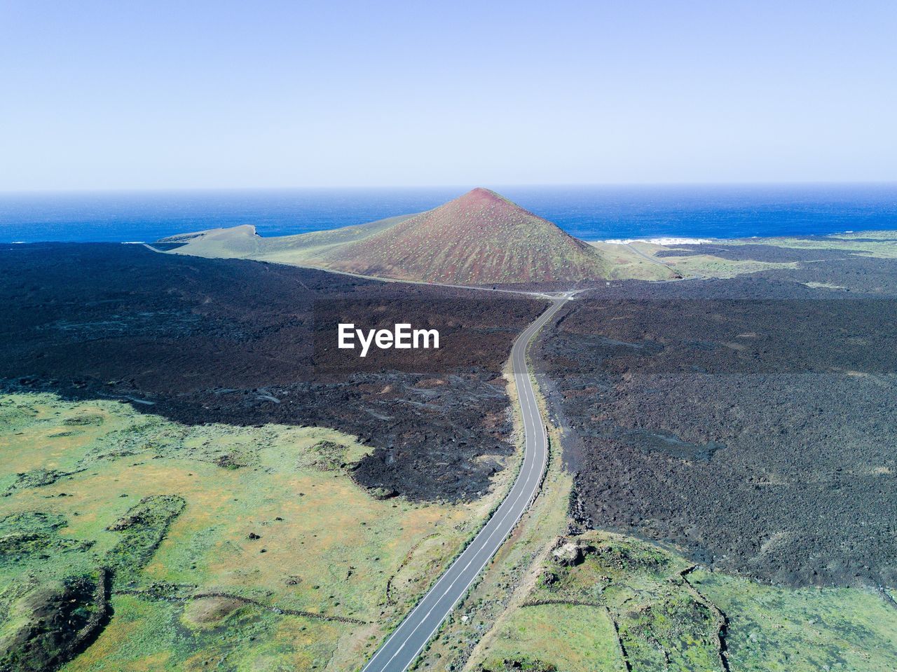 Aerial view of road passing through landscape