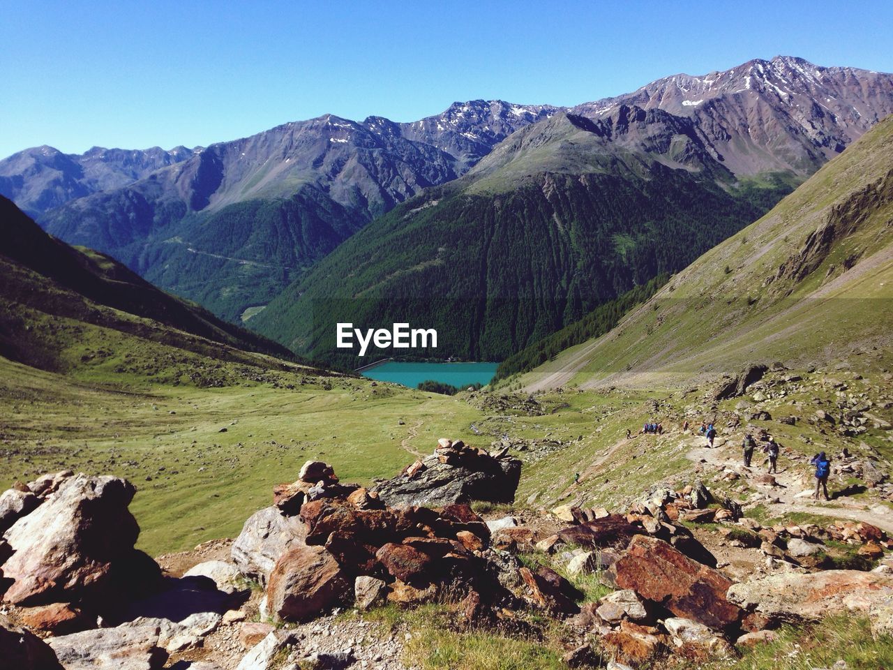 Distant group of hikers in alps