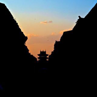 VIEW OF BUILDINGS AT SUNSET