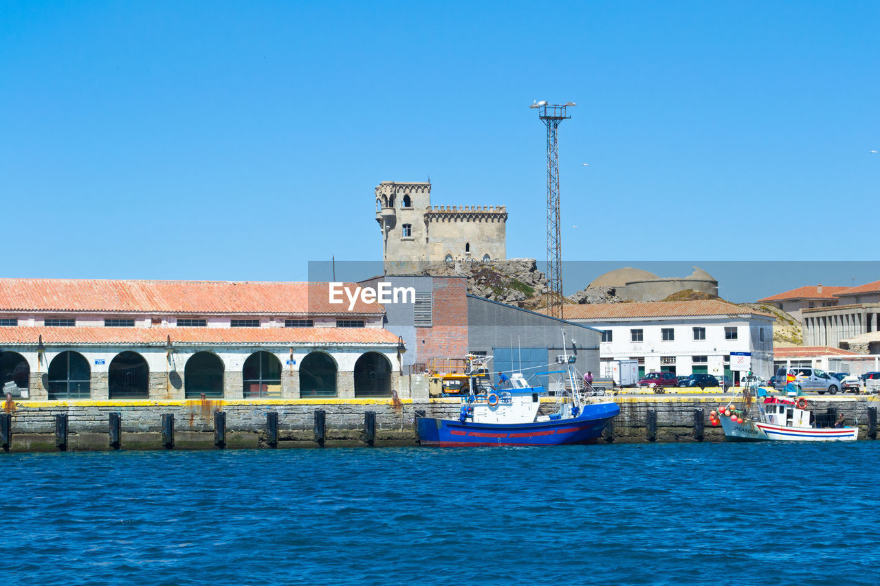 VIEW OF BUILT STRUCTURES WITH WATERFRONT