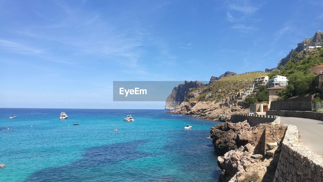 Scenic view of sea against blue sky