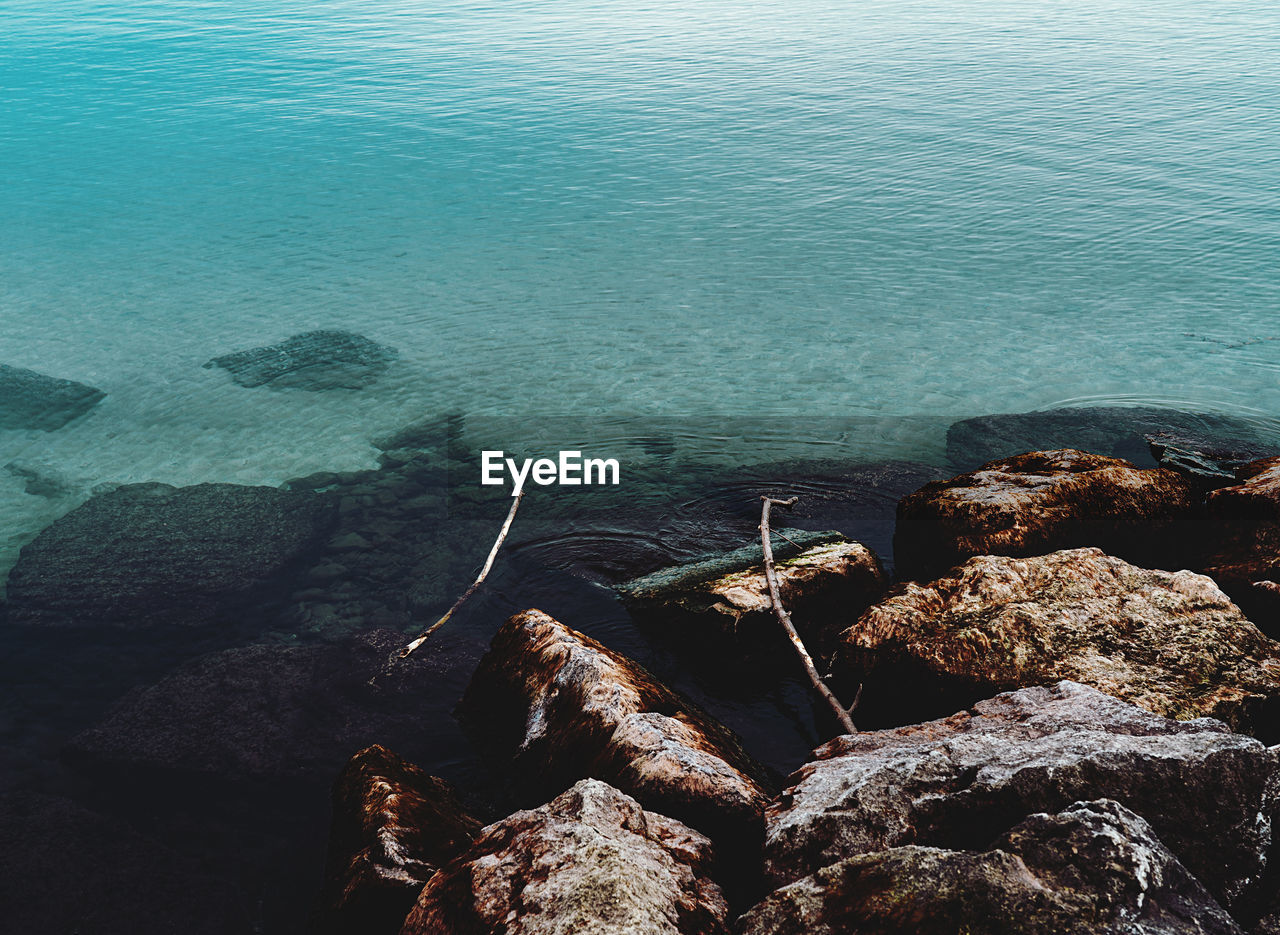 water, sea, rock, ocean, high angle view, nature, coast, beauty in nature, tranquility, day, no people, beach, land, scenics - nature, tranquil scene, shore, terrain, outdoors, sunlight