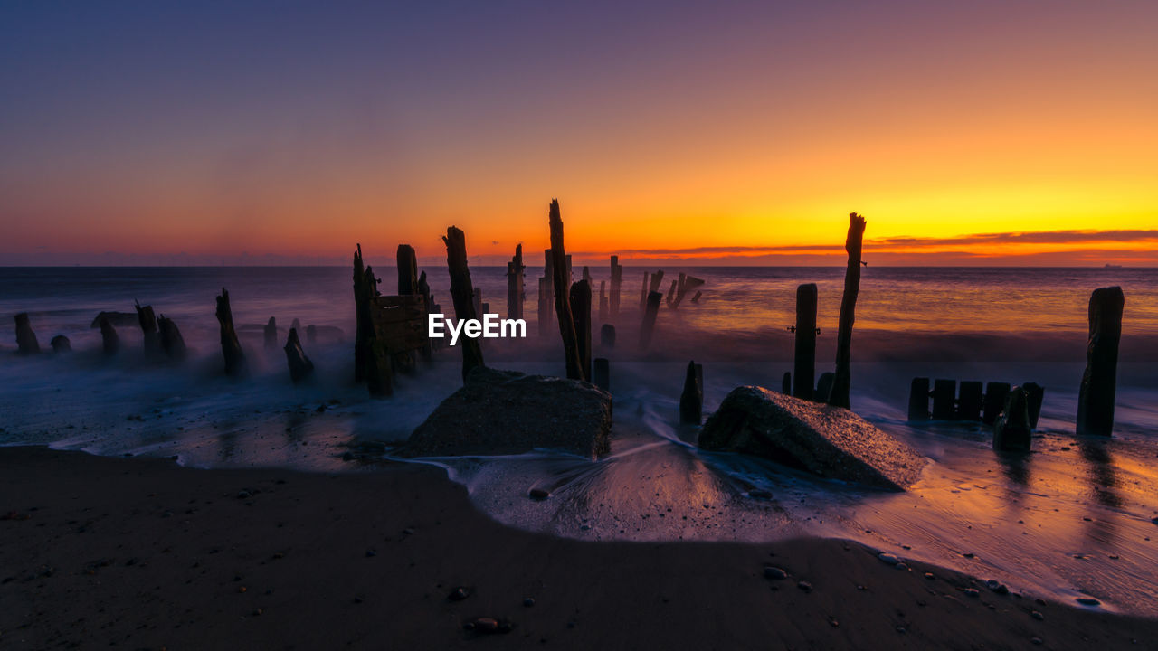 Scenic view of sea against sky during sunset