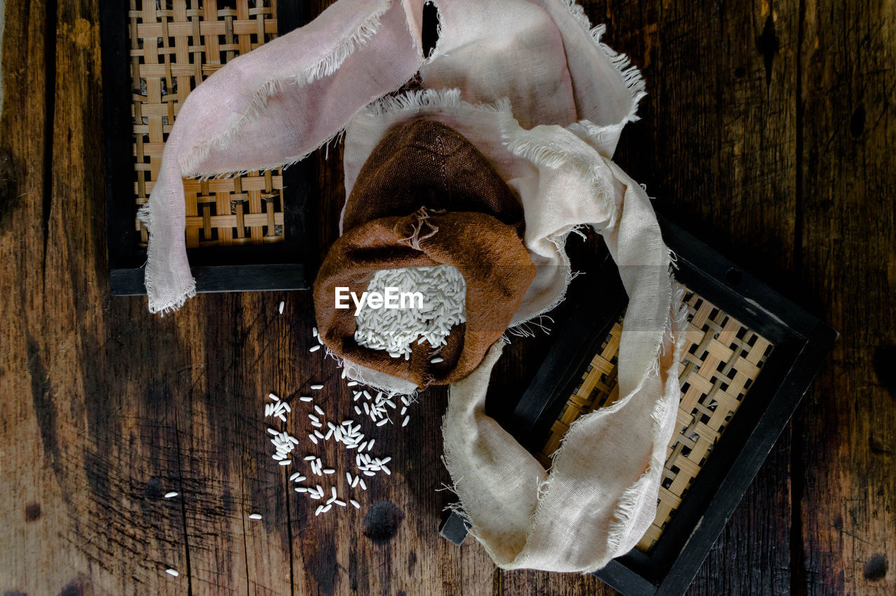 HIGH ANGLE VIEW OF A BREAD ON WOODEN TABLE