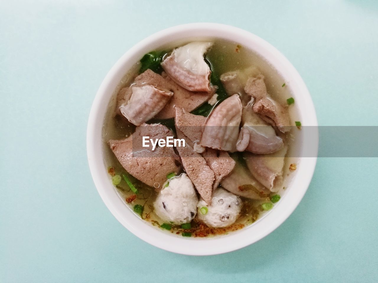 HIGH ANGLE VIEW OF FRESH SOUP IN BOWL