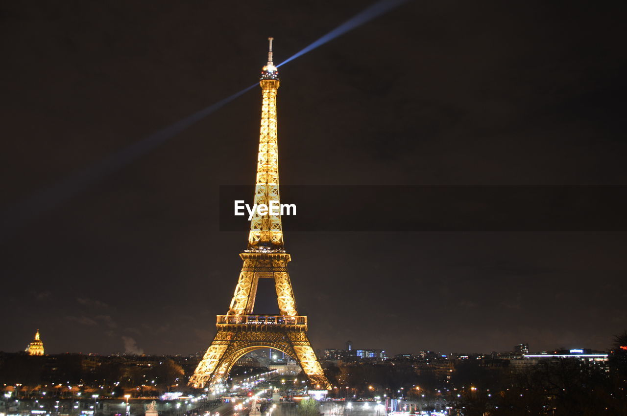 VIEW OF ILLUMINATED CITYSCAPE AT NIGHT