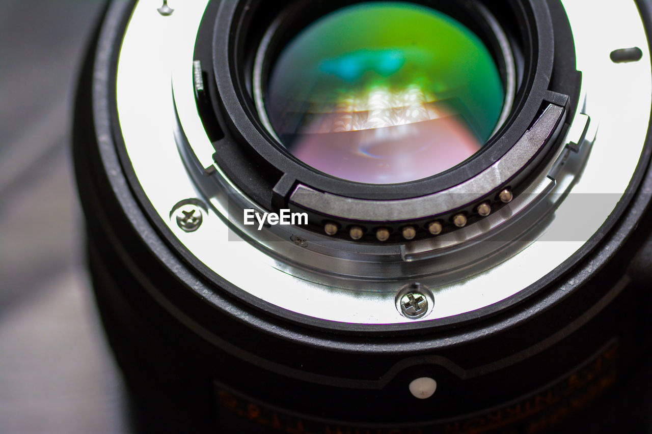 Close-up of camera lens on table