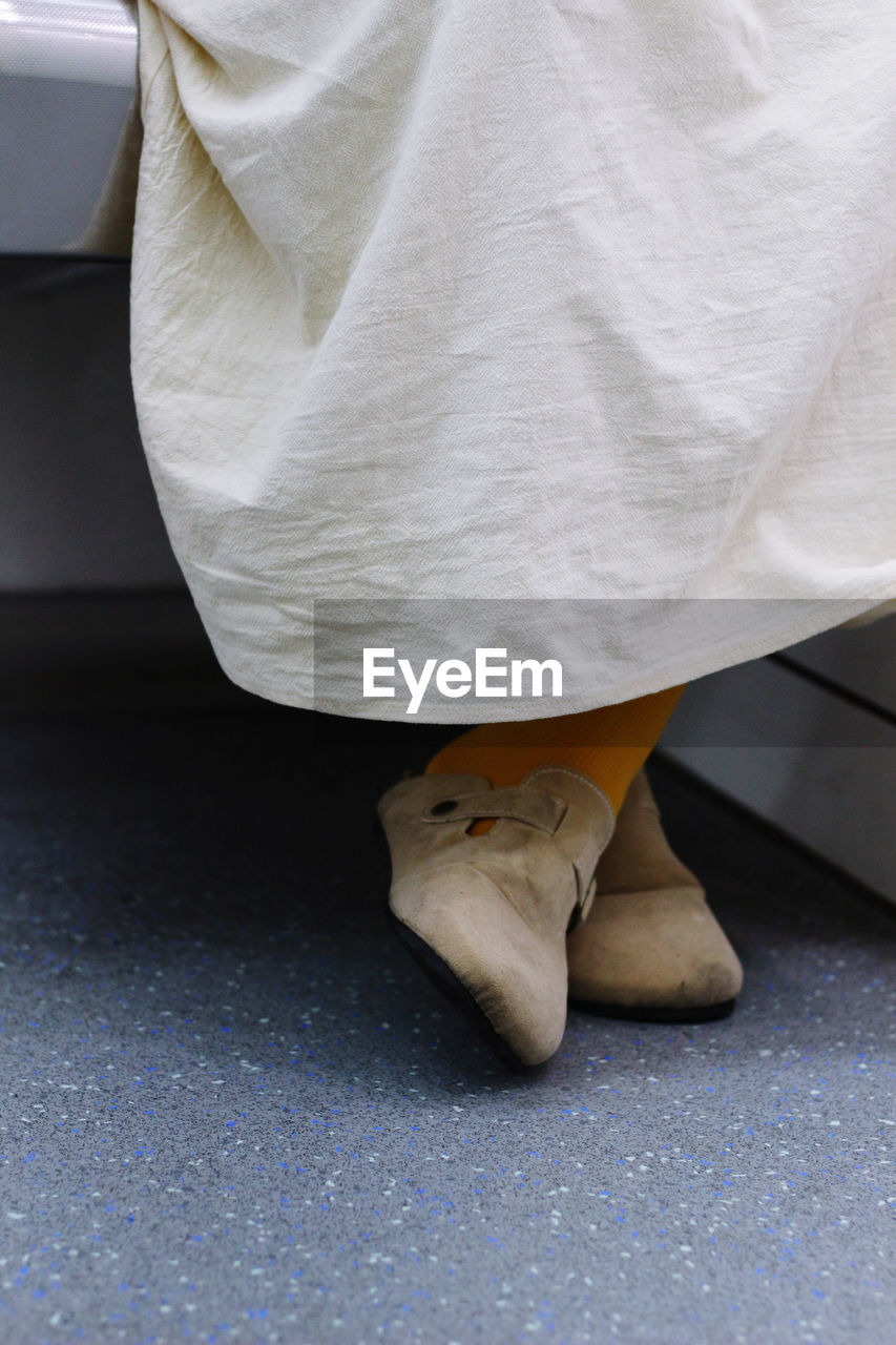 white, low section, human leg, one person, adult, limb, human limb, women, dress, shoe, human foot, indoors, spring, textile, lifestyles, yellow, footwear, clothing, standing
