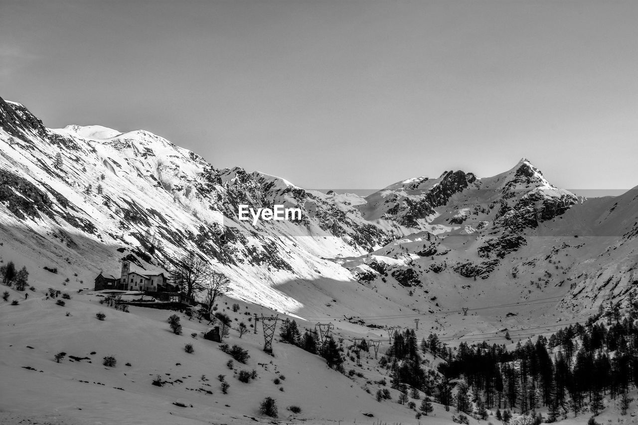 Scenic view of snow covered mountains against sky